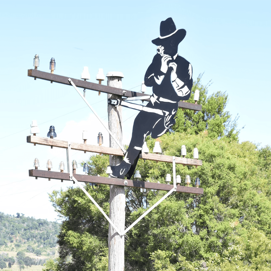 The Lineman, this sculpture is dedicated to the unsung heroes who, from 1854, strung aerial telegraph and telephone wires across Australia.